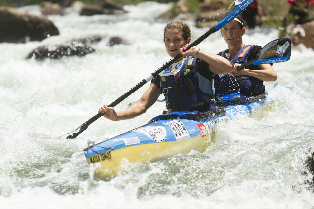 A golden smile for Abbey Ulansky and Robyn Kime after clinching a hard-fought women's title at the 2014 Dusi Canoe Marathon.